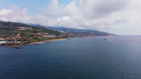 clear coastal view of liguria, italy, with hills and village near the mediterranean sea