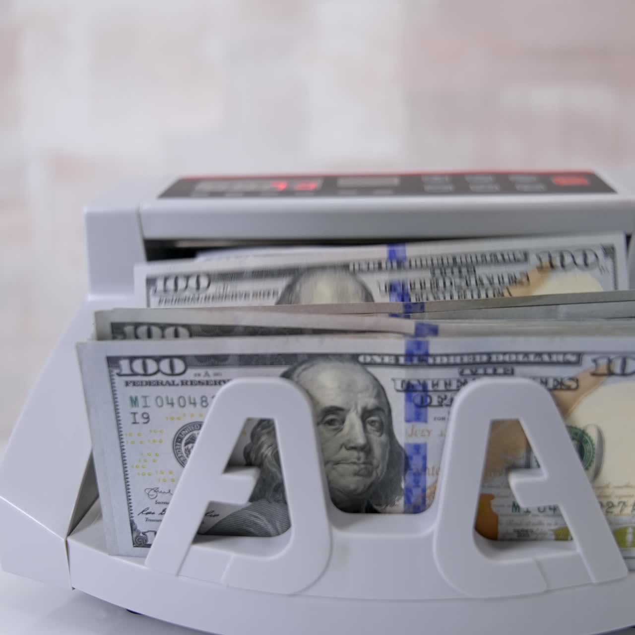 Money counting machine. Counting dollar banknotes