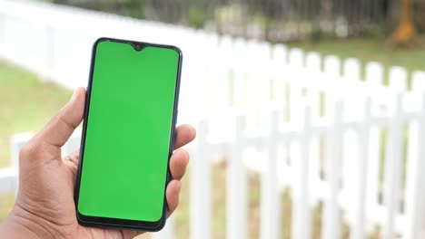 Close-up-of-young-man-hand-using-smart-phone