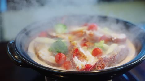 Japanese-Hot-Pot-Boiling-Away,-Steam-and-Delicious-Ise-Spiny-Lobsters-4k