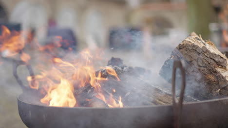 flickering-flames-and-smoke-of-burning-bonfire-in-a-bowl,-slow-motion