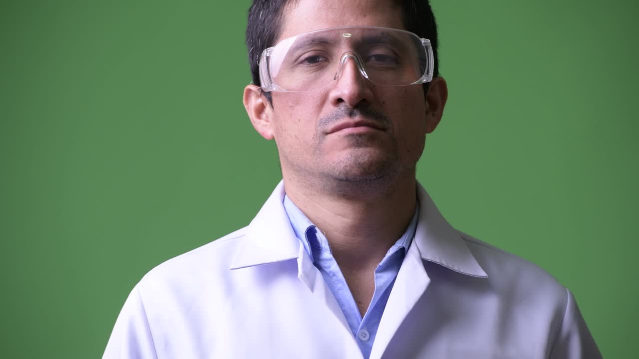 Hispanic man doctor with protective glasses