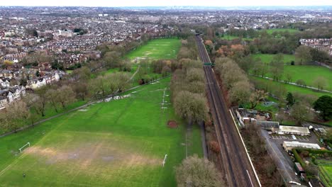 above a nearly empty wandsworth common early in the morning in london uk