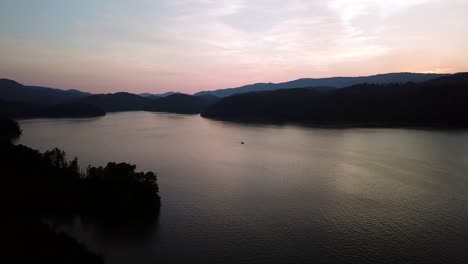 Aerial-Push-over-Watauga-Lake-at-sunset,-4K