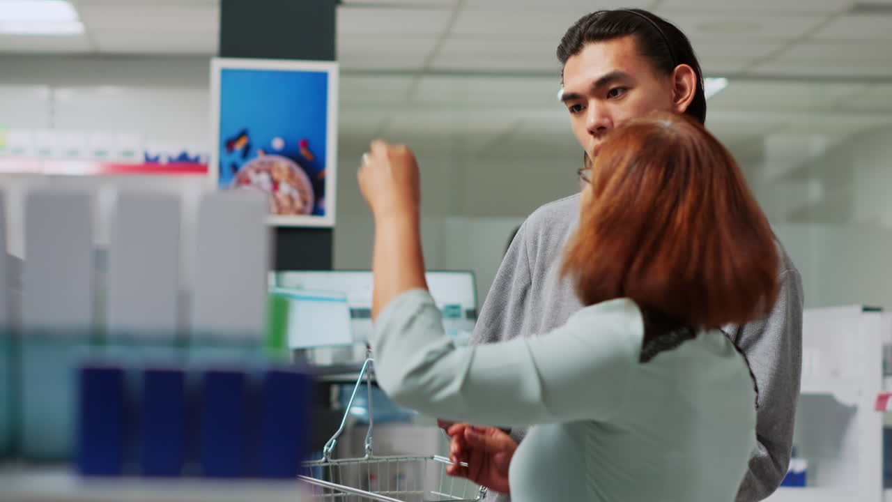 People shopping for medicine in a pharmacy