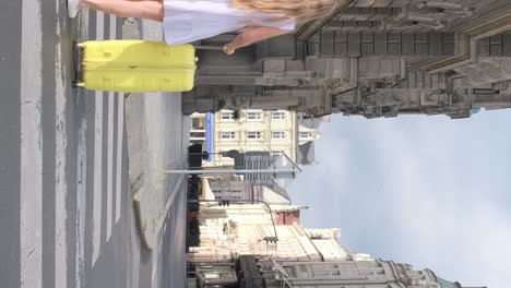 beautiful female tourist walking through the beautiful streets of paris, france. tourism and travel in europe, historical architecture of museums and art galleries