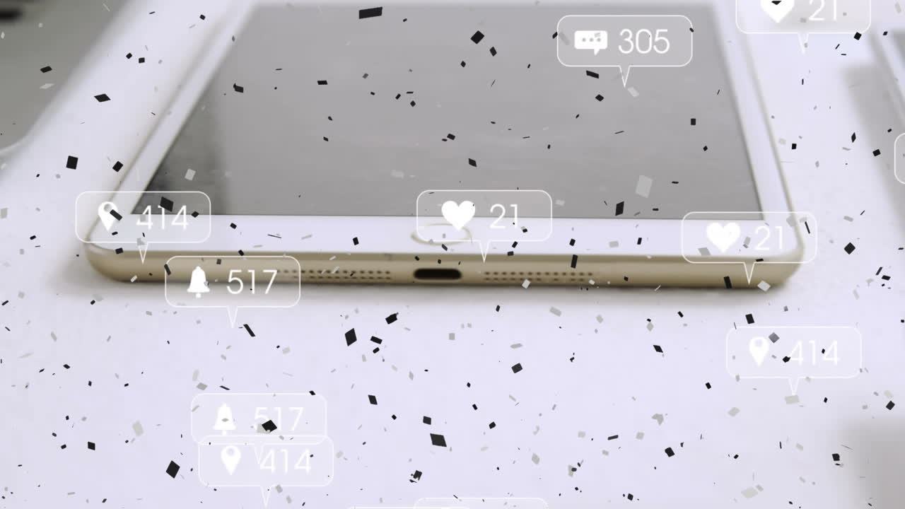 소셜 미디어 아이콘과 태블릿 위에 떨어지는 콘페티의 애니메이션