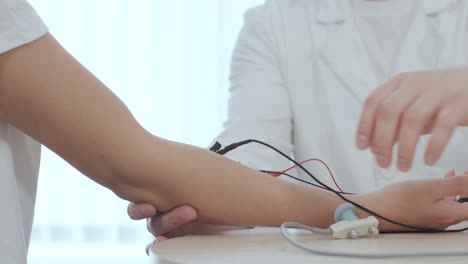 patient nerves testing using electromyography at medical center