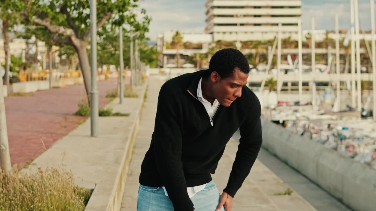 Man experiencing abdominal pain outdoors