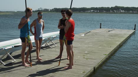 side view of male rower discussing on the jetty