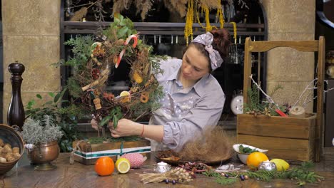 florist at work. how to make christmas wreath with floral arrangement. step by step, tutorial