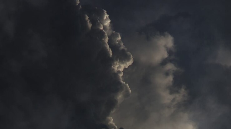 dark cumulonimbus clouds with thunderstorms raging inside