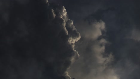 dark cumulonimbus clouds with thunderstorms raging inside