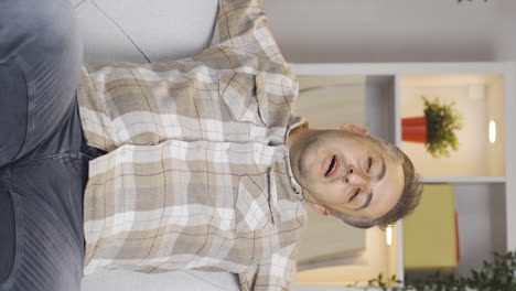 Vertical-video-of-Relaxed-man-happy-and-peaceful.