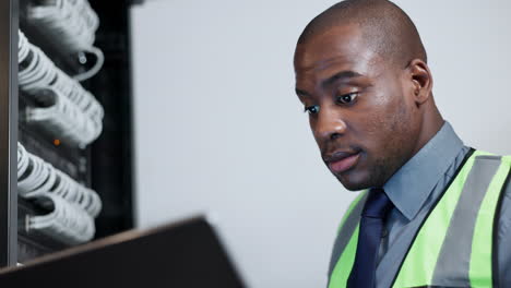 cyber security, laptop and black man in server