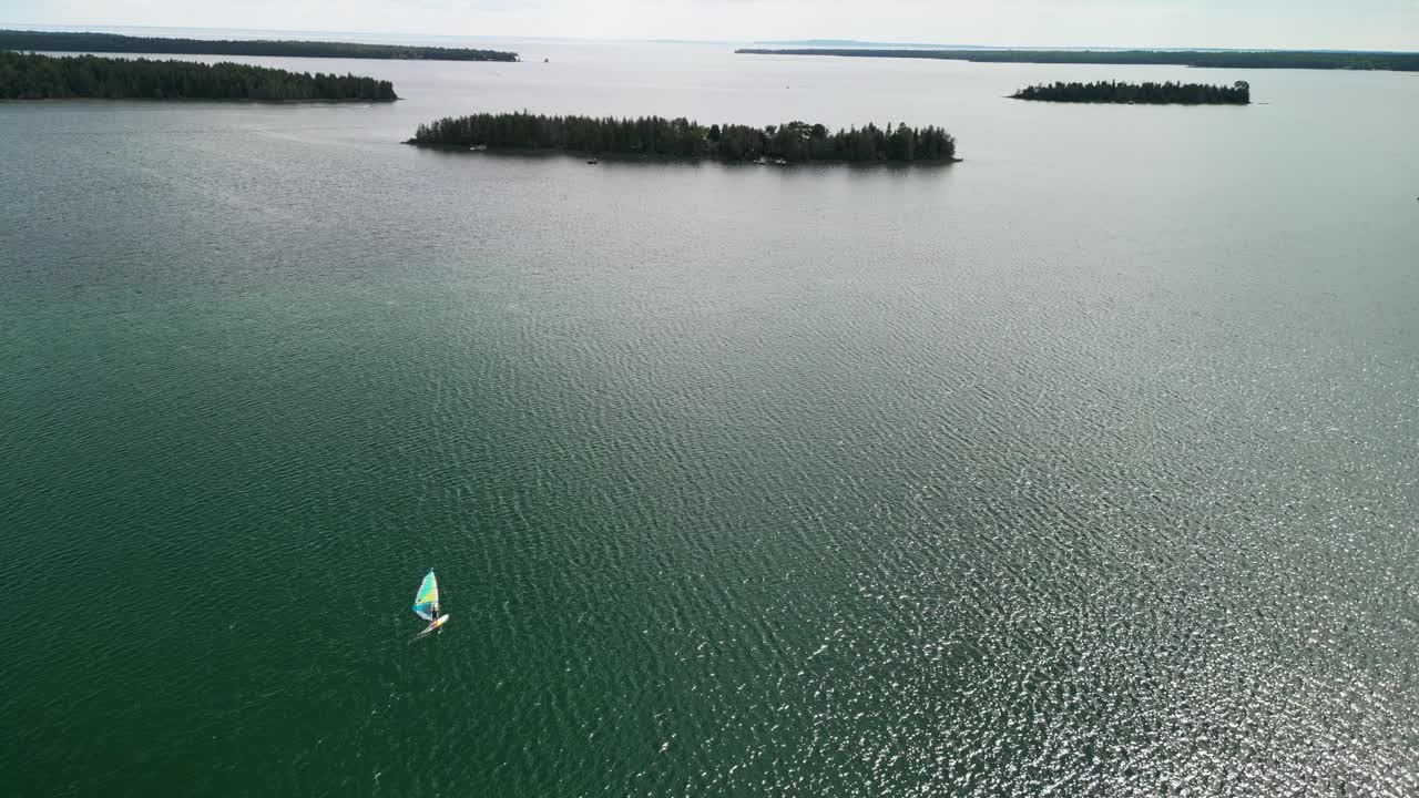 Aerial view of windsurfer headed out to lake huron islands, les cheneaux islands, michigan