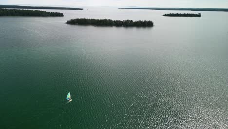 aerial view of windsurfer headed out to lake huron islands, les cheneaux islands, michigan