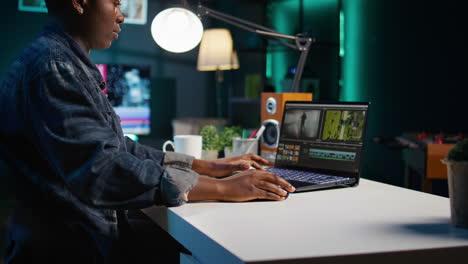 woman working on video editing software at night