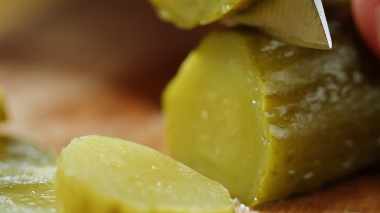 Sliced Pickles on a Wooden Cutting Board