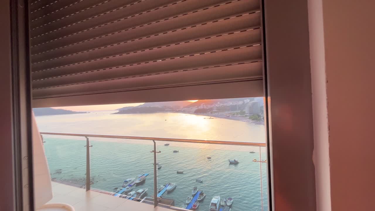 Lovely sunrise shot of electric blinds revealing the lovely fishing town of Rafailovici in Montenegro very early in the morning before anyone is awake and outside