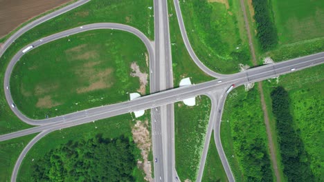 busy urban traffic. aerial top view traffic on circle road in city at day. 4k stock footage.