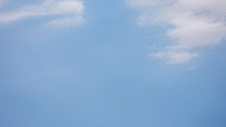 Low angle shot of blue sky with white clouds