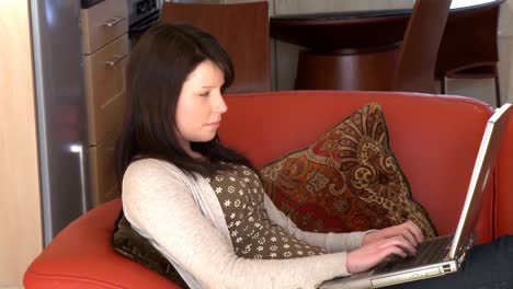 Peaceful-woman-using-a-laptop