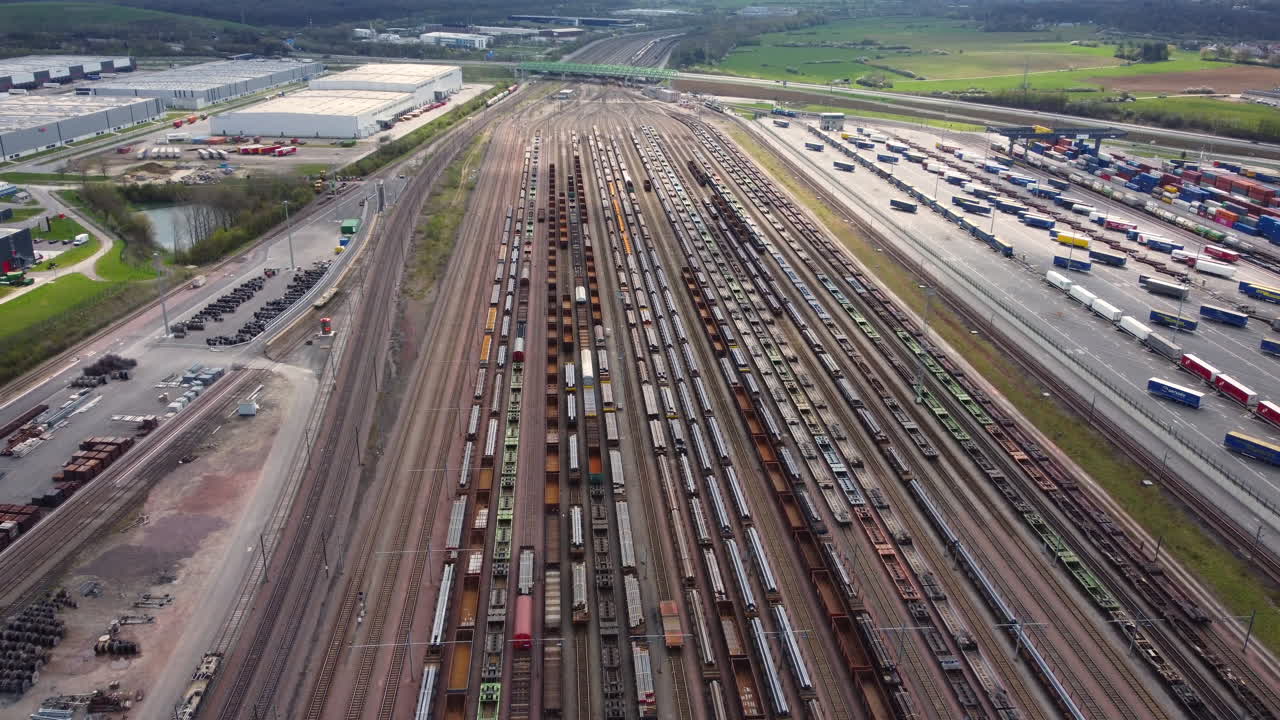 Aerial View of a Busy Freight Train Yard and Logistics Terminal