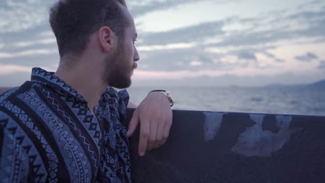 young man looking at the sea.