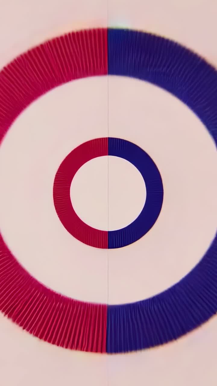 Vertical video: Playing split-color rings rotating on white backdrop, pulsing revealing alignment
