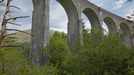 scotland train bridge viaduct from below columns reveal shot