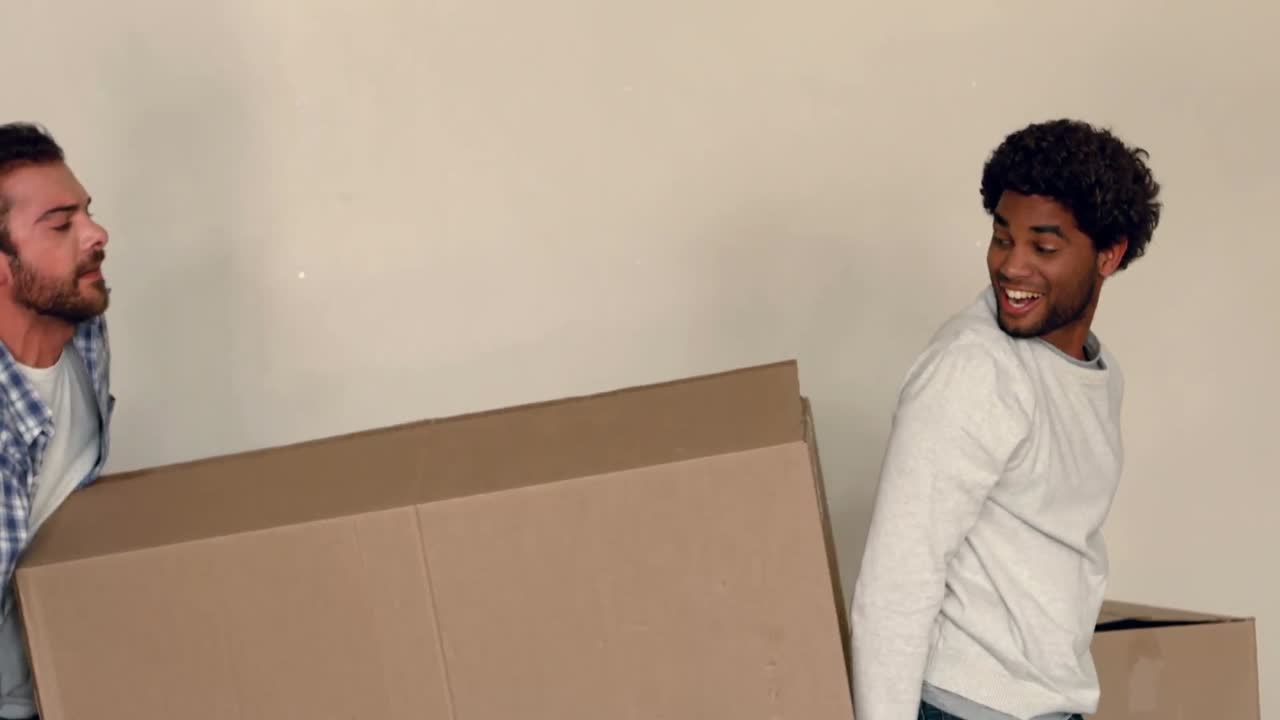 Smiling men relocated an apartment