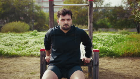 man trains with commitment at the park under the sun