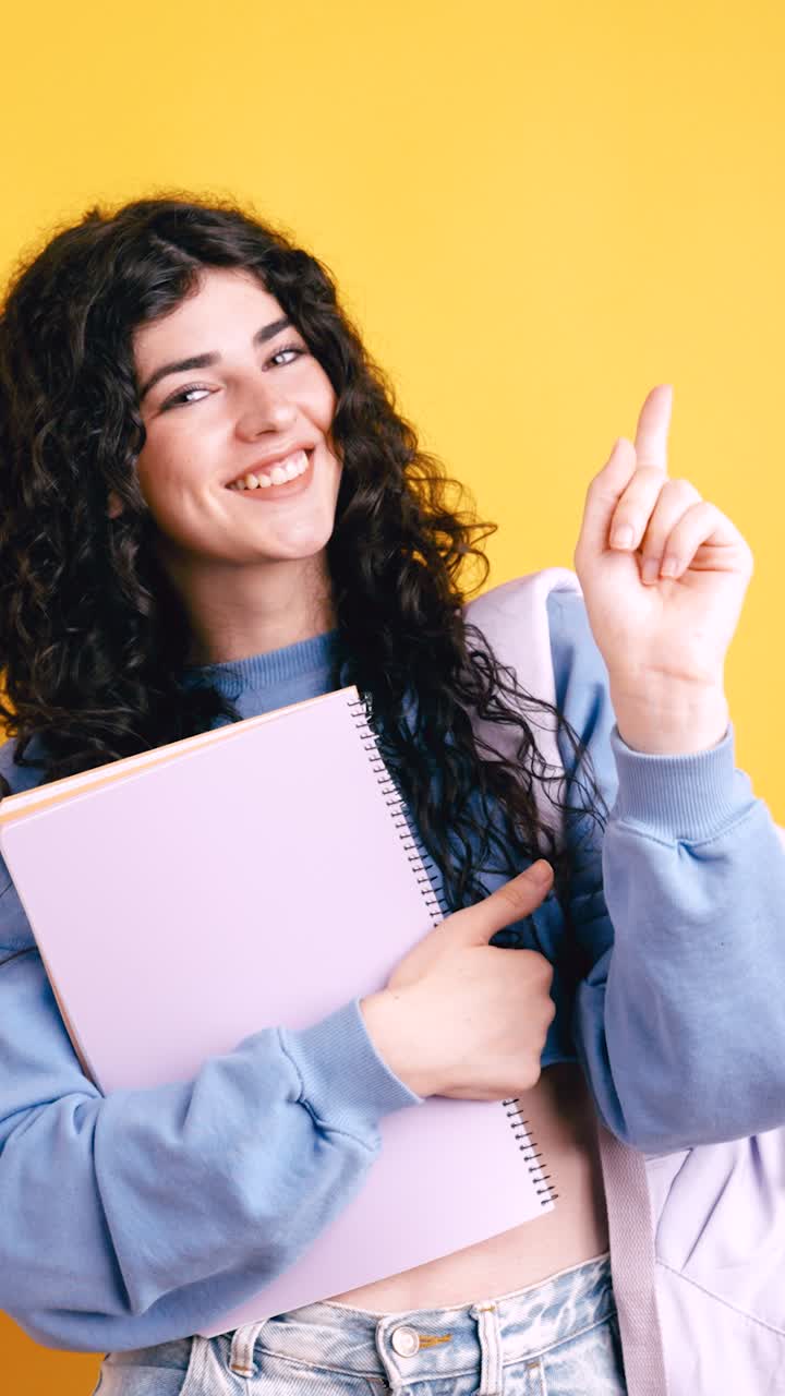 Young Woman Student with Notebook