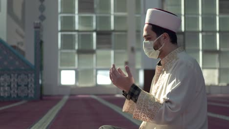 masked muslim imam praying