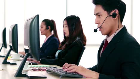 business people wearing headset working in office