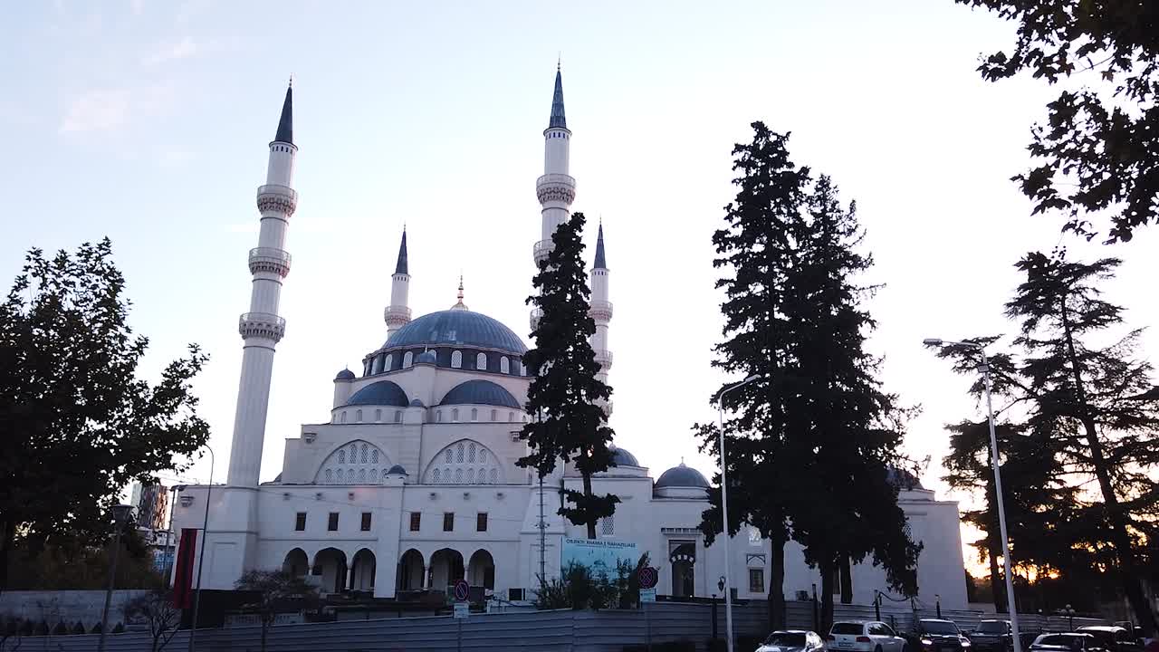 The Namazgjah Mosque In Tirana, Albania with camera pan from right to left. Dusk time of the day, mid range shot
