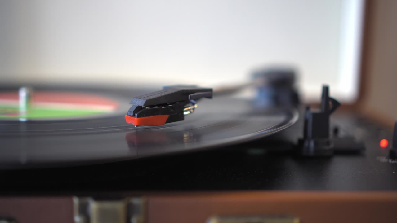 Vinyl record player . black vinyl record is spinning on turntable.
