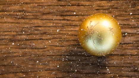 falling snow with christmas bauble decoration