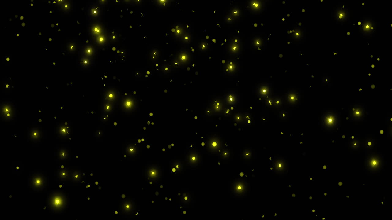 Animazione di punti gialli luminosi che cadono su sfondo nero