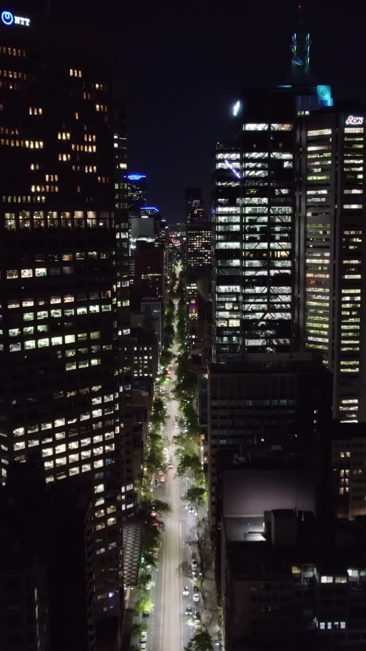 Aerial Night View of a City with Illuminated Skyscrapers
