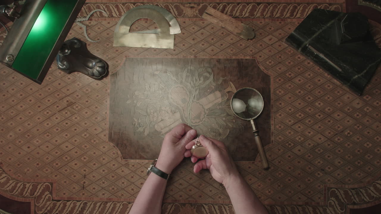 An older man evaluates an antique watch