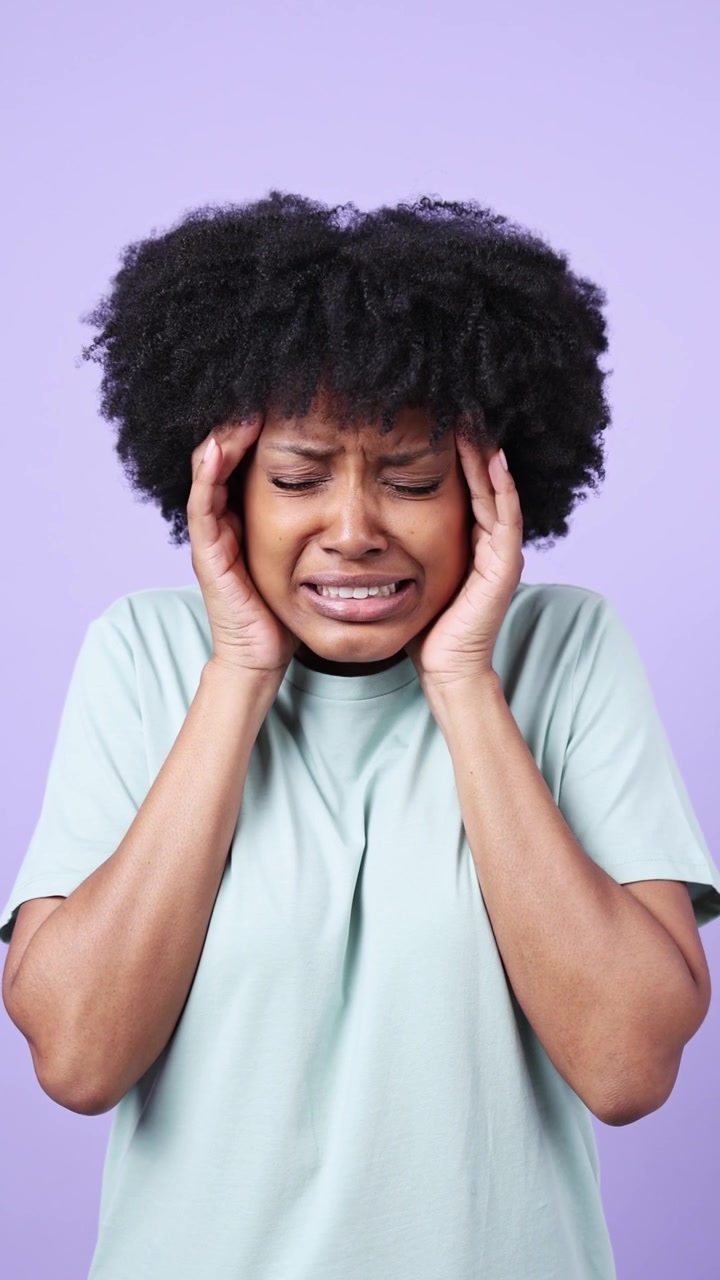 Young Black Woman Suffering from Headache and Toothache