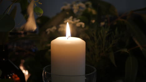 candle light glowing at a night wedding reception