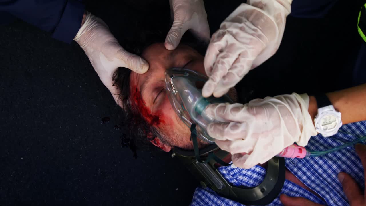 Emergency medical technician posing an oxygen mask