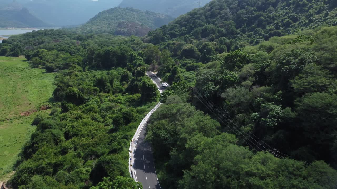 Drone shot of Pollachi To Valparai scenic route road trip near Aliyar Reservoir and Dam, Coimbatore, Tamil Nadu, South India