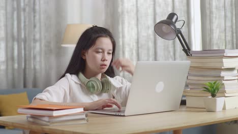 student with headache while studying