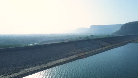 aerial drone view of karamchat dam in bihar, showcasing the dam’s importance in flood control and water management.