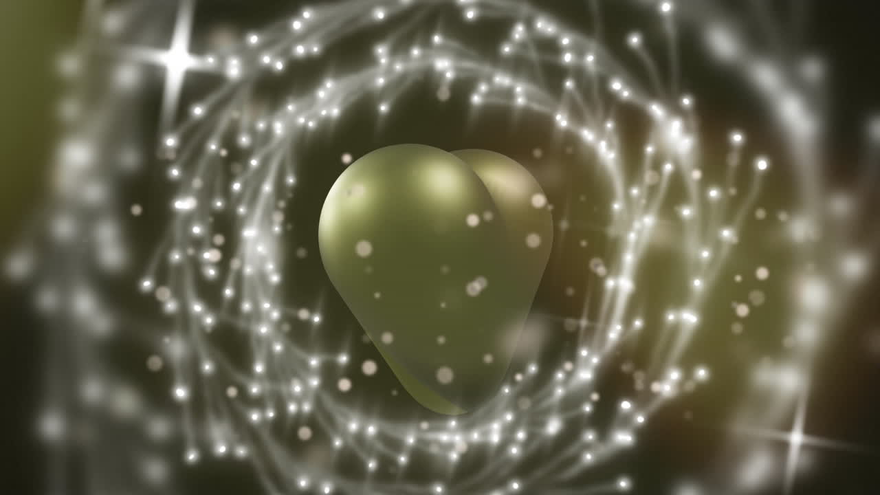 animación de puntos de luz y círculos sobre un corazón dorado sobre fondo negro.