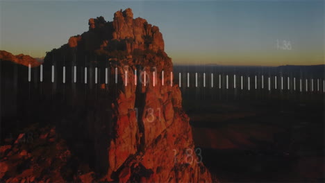 numerical data animation overlaying rocky mountain landscape in scenic view